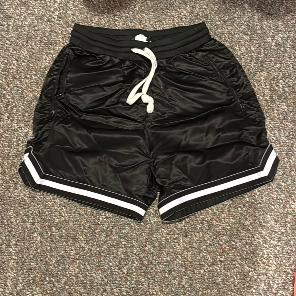 Fashion Nova gym shorts with zipper pockets, size M
